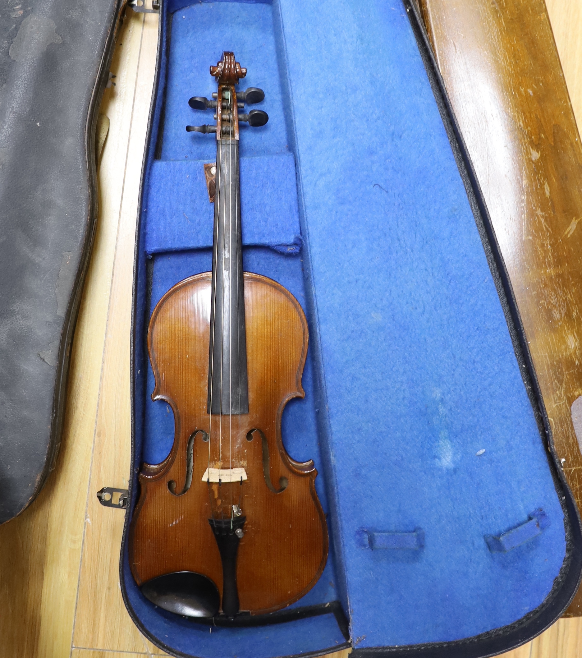 One violin, three violin cases and a cased set of bagpipes